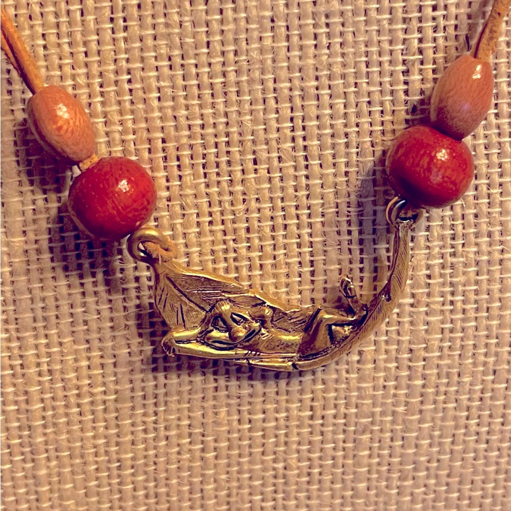 The Lion King Timon Relaxing on a Banana Leaf Necklace